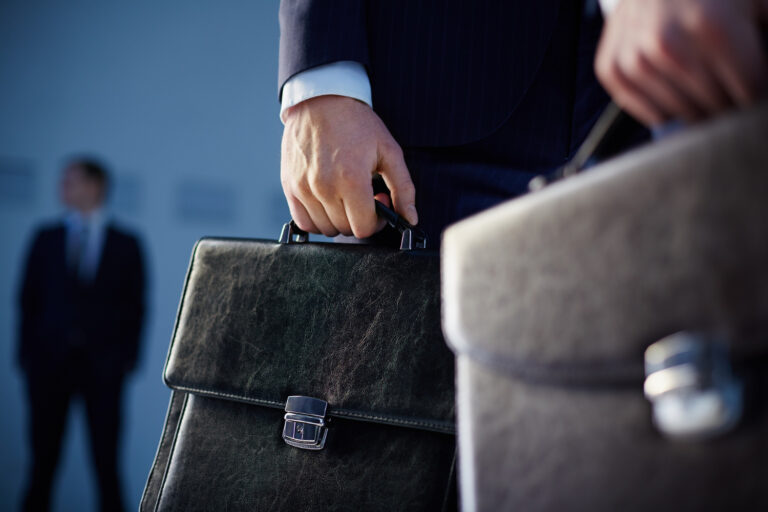 close-up-workers-with-briefcases